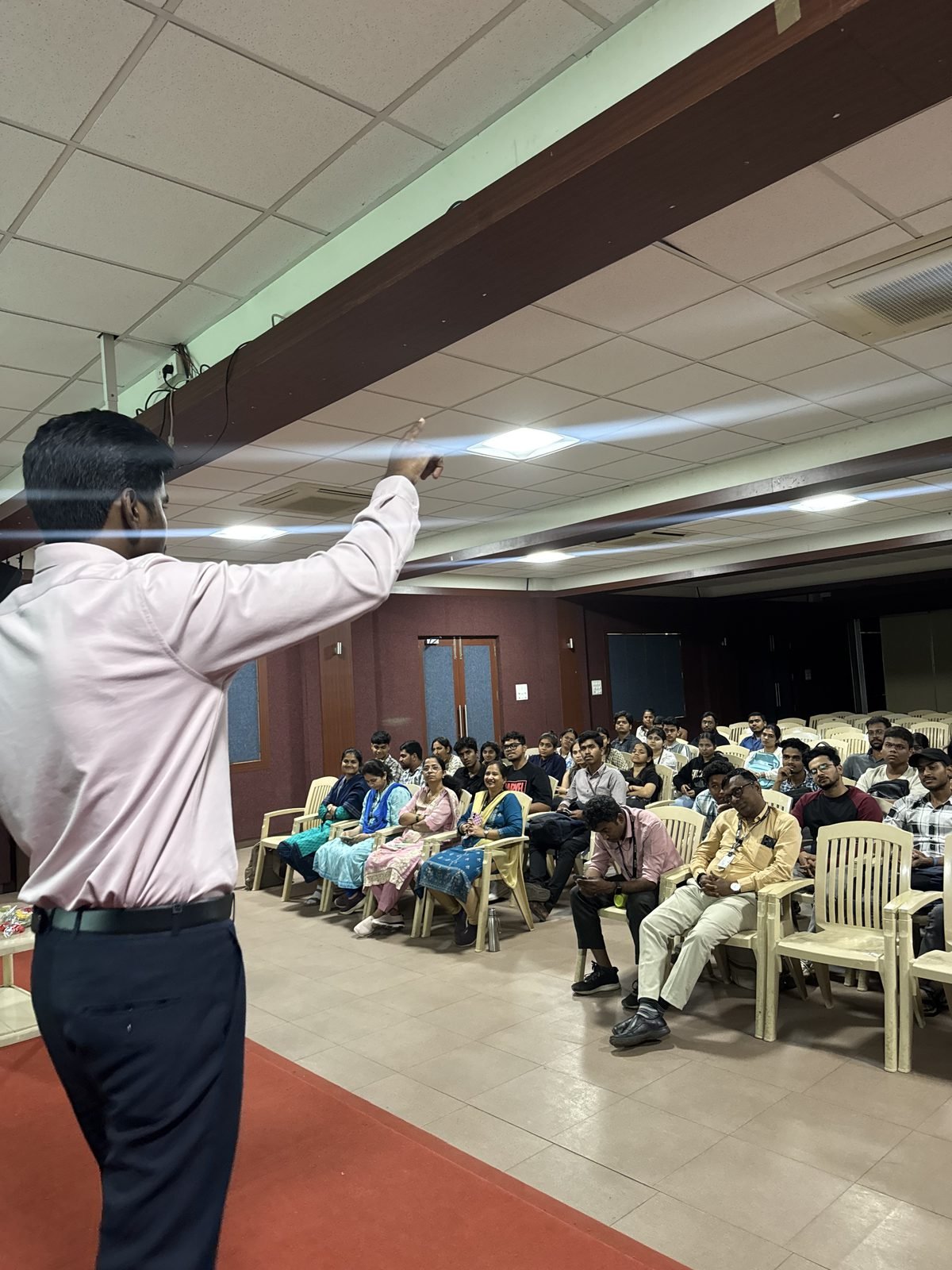 Akash Kamble engaging with the audience during a technical session